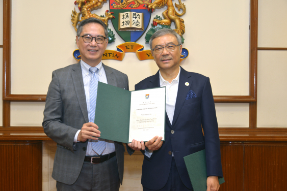 Ir. Tony Shum (right) receiving two Certificates of Appreciation from Ir. Ricky Lau, JP (left)